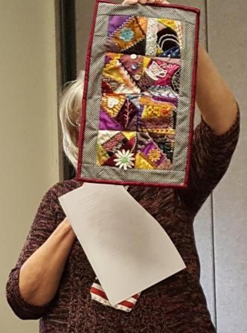 Our lady with the Show & Tell Twist ideas, Janice, proudly shows her crazy quilt she completed from the January class taught by Babbette.